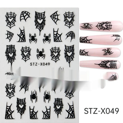 Assortment of black and silver nail sticker designs including cartoon and French tip patterns on a plastic sheet.