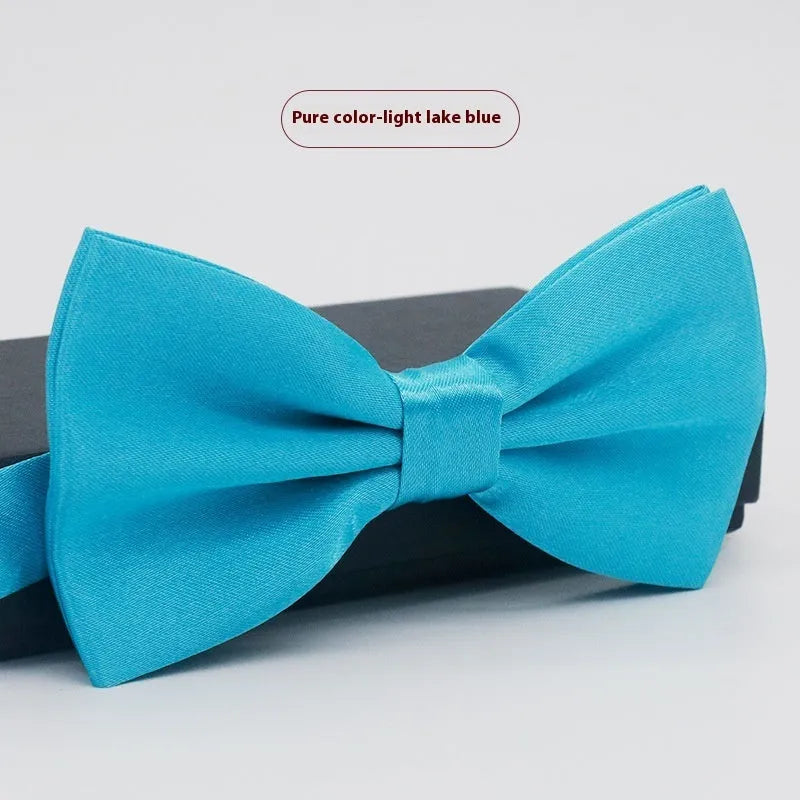 A solid colour pre-tied bow tie with an adjustable neck strap, shown in a classic flat head shape.