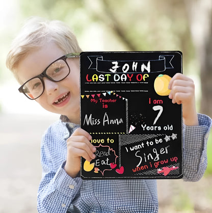 Wooden first day of school blackboard sign on a natural wood background.