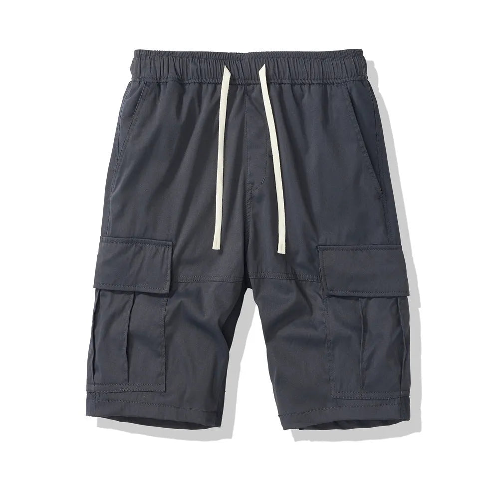 Men's loose cropped pants in Korean style with multiple pockets, shown in brick red colour