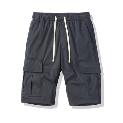 Men's loose cropped pants in Korean style with multiple pockets, shown in brick red colour