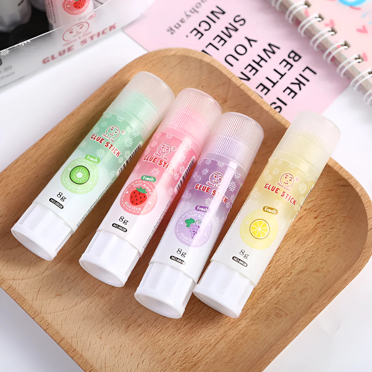 Jelly solid glue stick with fruit scent, 8.5 cm long, for student and craft use.