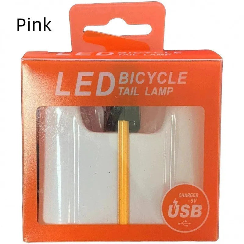 Waterproof USB rechargeable bicycle tail light in blue, pink, red, white, or yellow colours