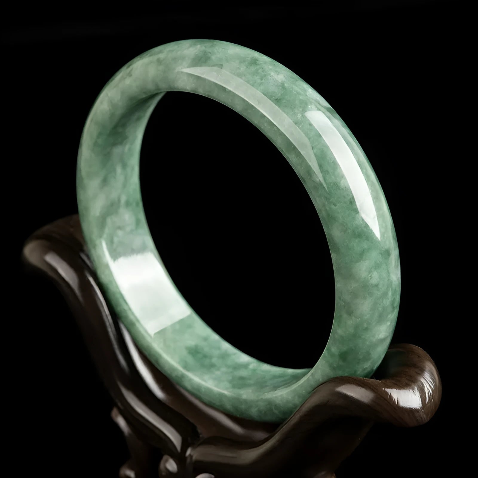 Natural deep pea green jade bracelet on wrist, simple style with certificate and gift box.