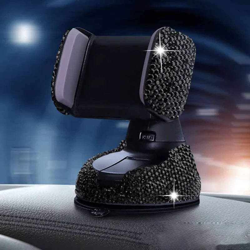 Diamond-encrusted car phone holder mounted on air vent with smartphone securely attached