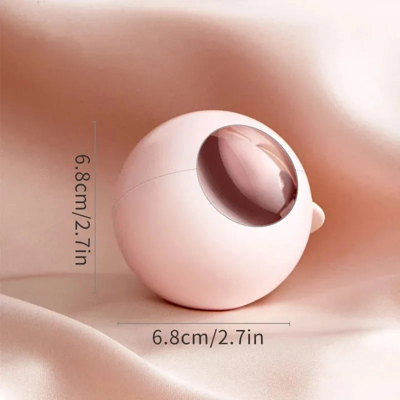 Washable reusable lint roller ball with handle for removing pet hair from fabrics.