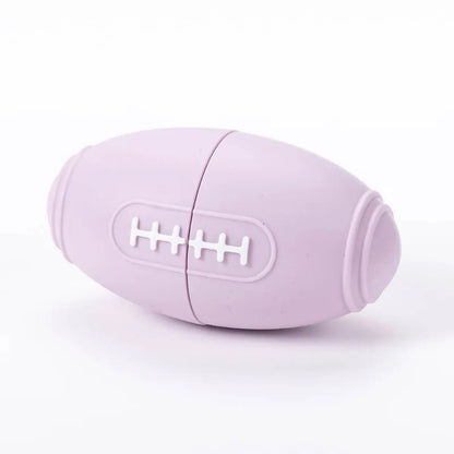 Blue silicone rugby ball dog toy with ridges and hollow centre for treats