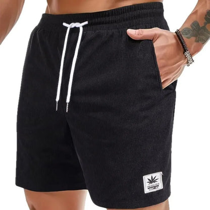 Men's straight-cut drawstring shorts in blue, shown on a model for summer casual wear.