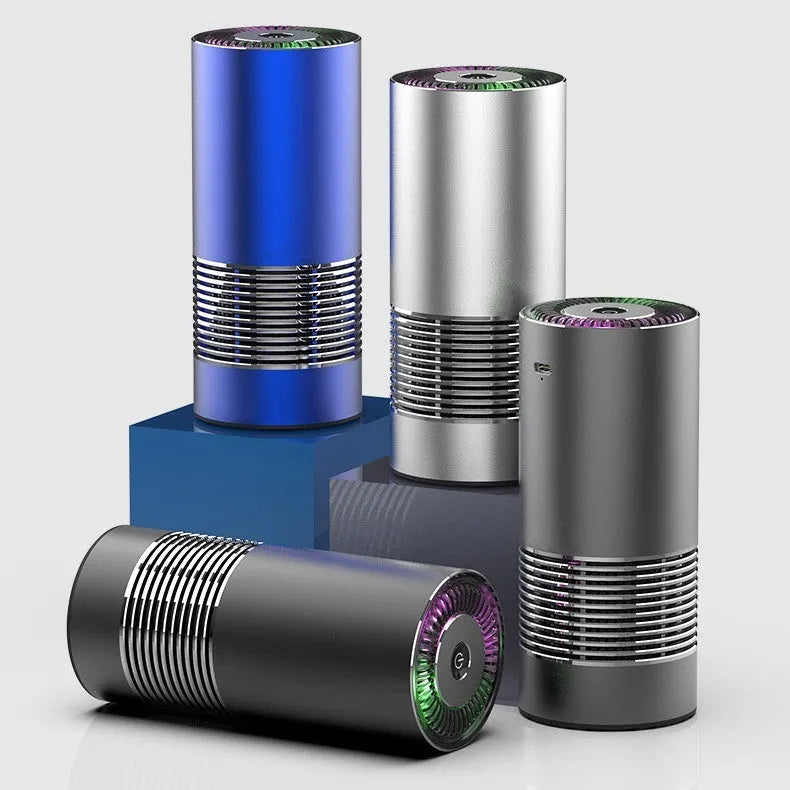Compact black car air purifier with aluminium alloy and ABS construction, shown next to a car USB port.