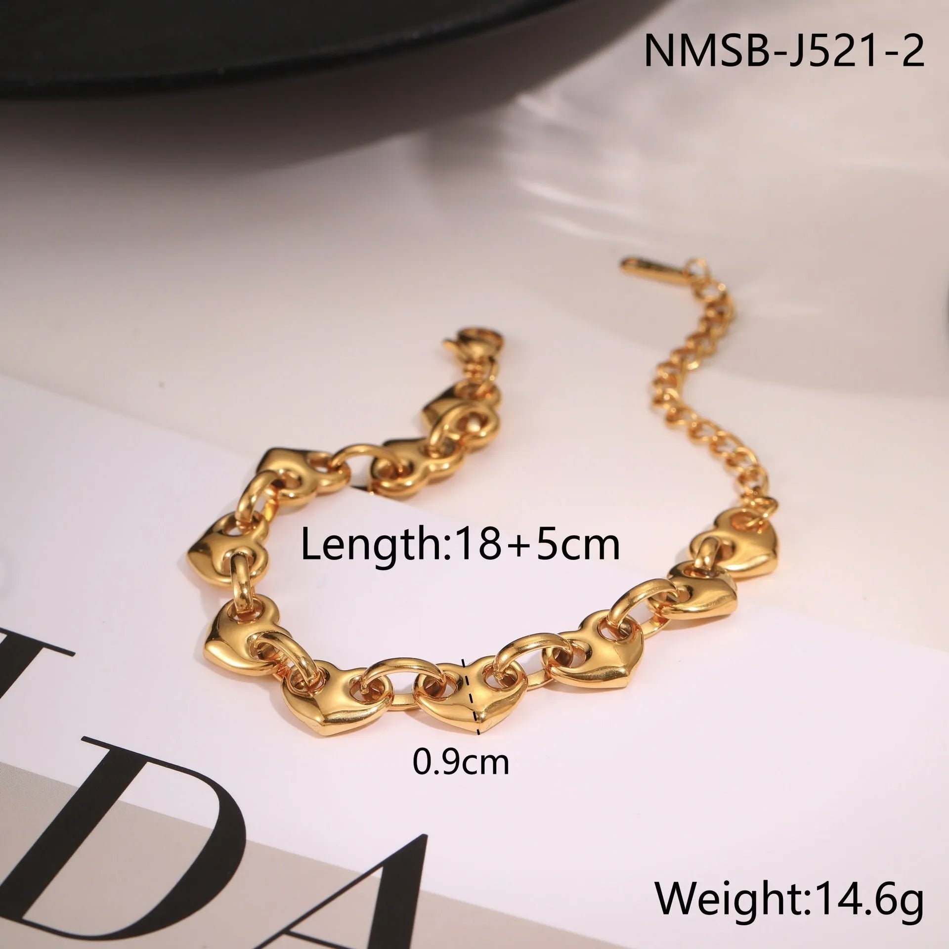 Women's hollow heart bracelet in stainless steel with 18K gold plating showing geometric design