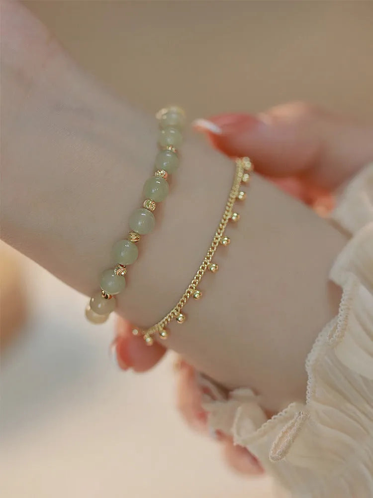 Handmade natural Hetian Jade women's bracelet in a classic beaded style.