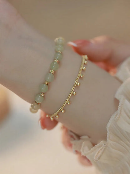 Handmade natural Hetian Jade women's bracelet in a classic beaded style.
