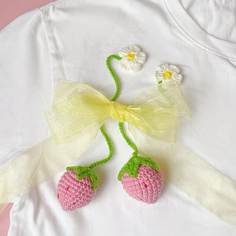 Handmade knitted wool crochet strawberry pendant necklace on a 35cm cord.