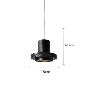 Industrial style iron chandelier with an adjustable hanging cord above a dining table.