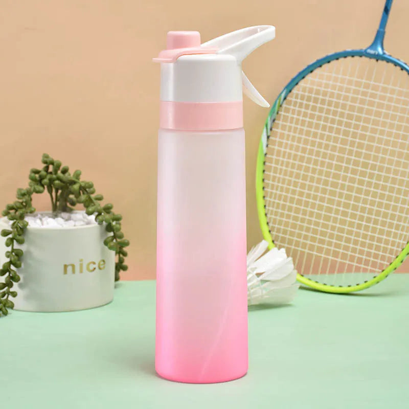 White spray water bottle with black leakproof lid and handle strap on a table