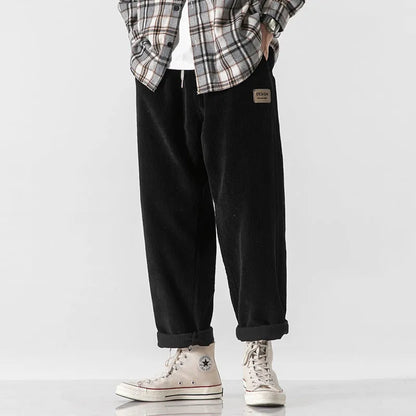 Men's loose fit corduroy sports trousers in Army Green colour with straight leg design and elasticated waist