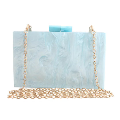 Small square acrylic clutch bag with long chain, marble pattern, and internal phone pocket