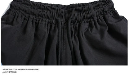 Loose-fit black sports shorts with elastic waistband and straight-leg cut for athletic wear