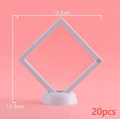 3D floating jewelry coin display stand in white and black, showcasing collectibles in mid-air