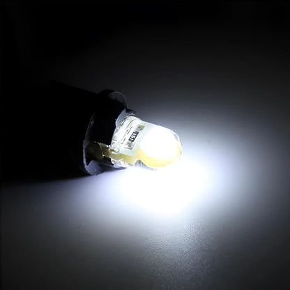 Pack of ten T10 wedge base LED car bulbs with COB chips in various colours on a white background