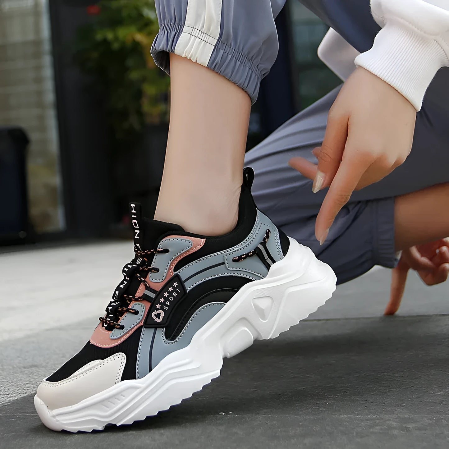 White women's thick-soled casual sports shoes with mesh upper, round toe, and buckle detail.