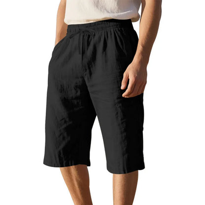 Men's loose-fit linen shorts in a solid colour with a drawstring waist and cropped leg length.