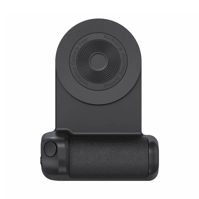 Black magnetic phone camera grip with rotatable bracket and ergonomic PU leather handle on a table.