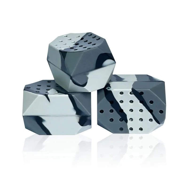 Two camouflage silicone facial muscle fitness balls for jaw training.