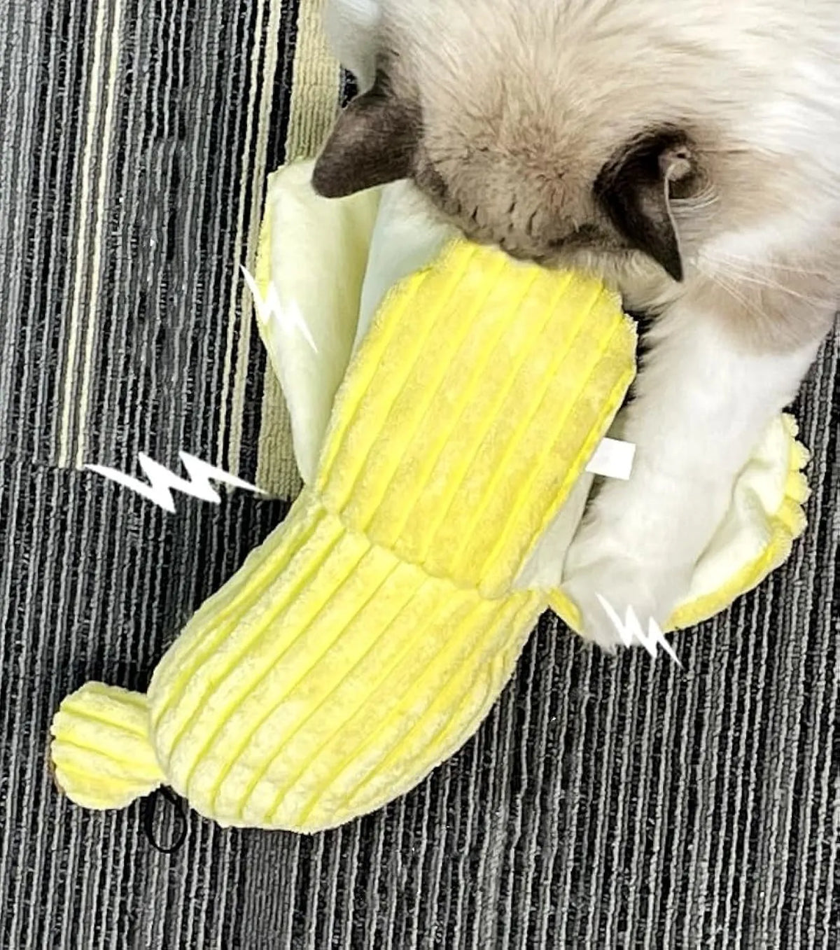 Yellow soft plush banana cat toy with green leaf, measuring 13 inches long, on a plain background.
