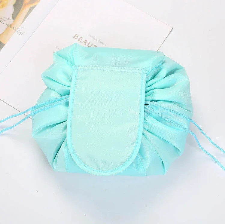 Stylish and roomy makeup travel bag with multiple color options, featuring a spacious interior and drawstring closure for secure storage of beauty essentials.