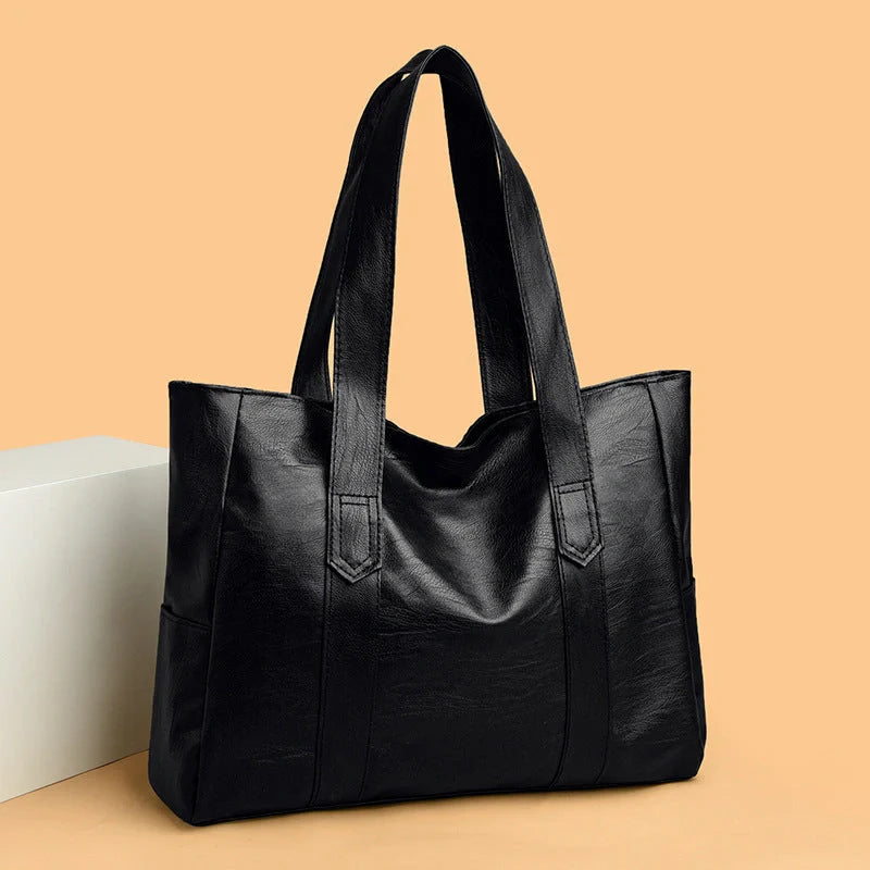 Stylish large capacity commuter shoulder bag in brown and black, perfect for autumn and winter fashion.