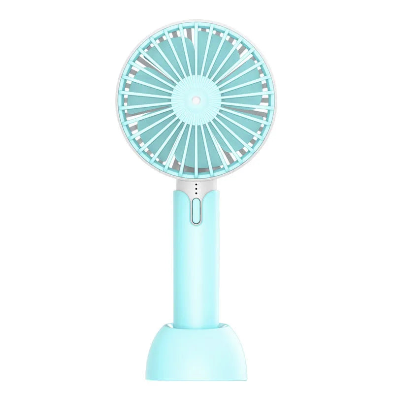 Blue handheld and desktop mini USB electric fan with three-speed control on a table.