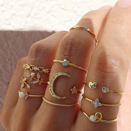 Gold-plated adjustable ring set with moon, star, and leaf charms in a bohemian style