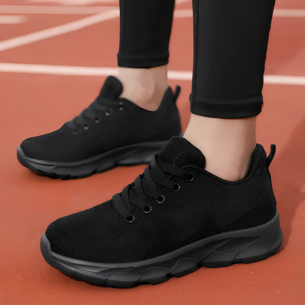 Women's black mesh running shoes with cross-strap and 3-5cm wedge heel, fabric upper with sewing details