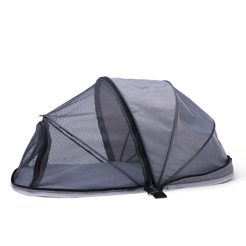 Black and blue half mesh portable folding tent for cats on a grey background.