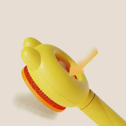 Green self-cleaning pet brush with release button and stainless steel comb for de-shedding cats and dogs.