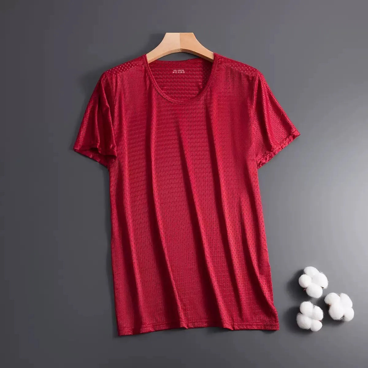 Man wearing a solid colour ice silk short sleeve t-shirt with a crew neck in a loose, casual fit for summer.