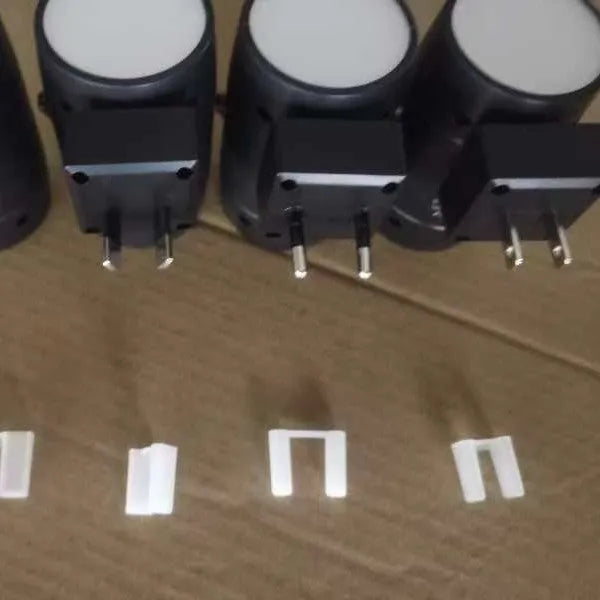 White adjustable brightness rotating induction night lamp showing light head rotation and plug