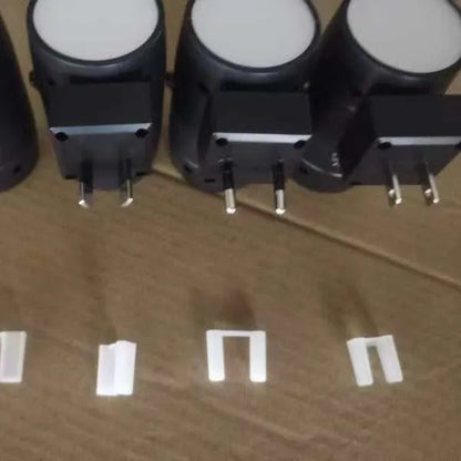 White adjustable brightness rotating induction night lamp showing light head rotation and plug