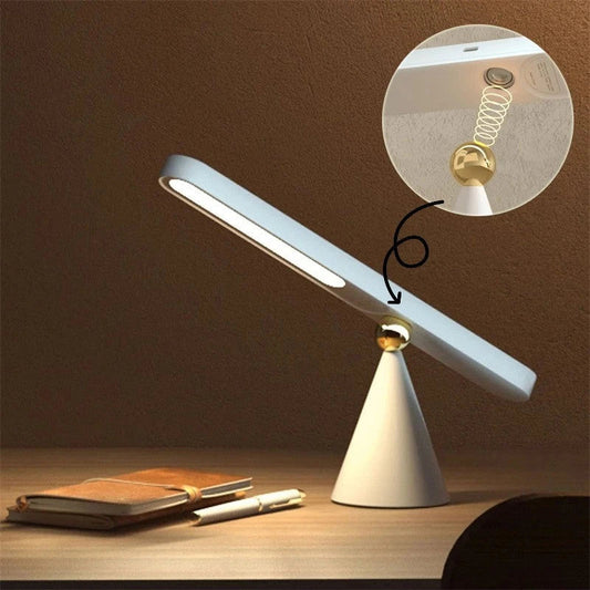 A modern desk lamp with a sleek geometric design, wireless charging, and touch controls for versatile lighting and charging in any workspace or home office.