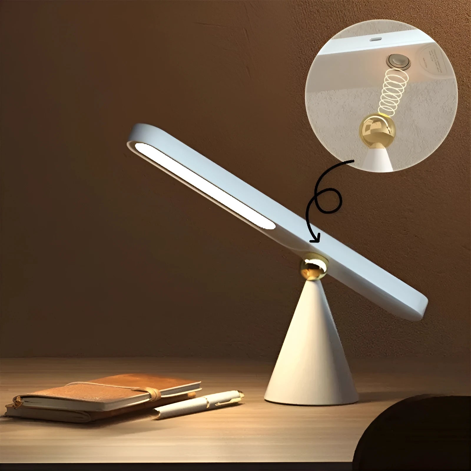 White geometric desk lamp with magnetic base and touch control on a wooden table.