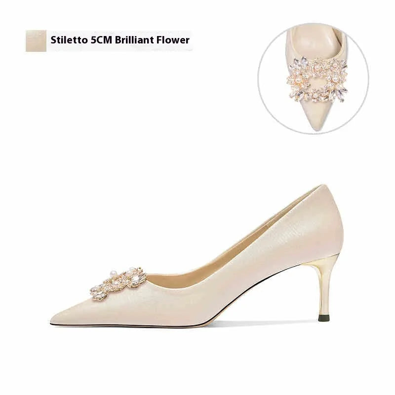 French crystal bridal high heel pump with rhinestones on cloth upper, showing pointed toe and stiletto heel.