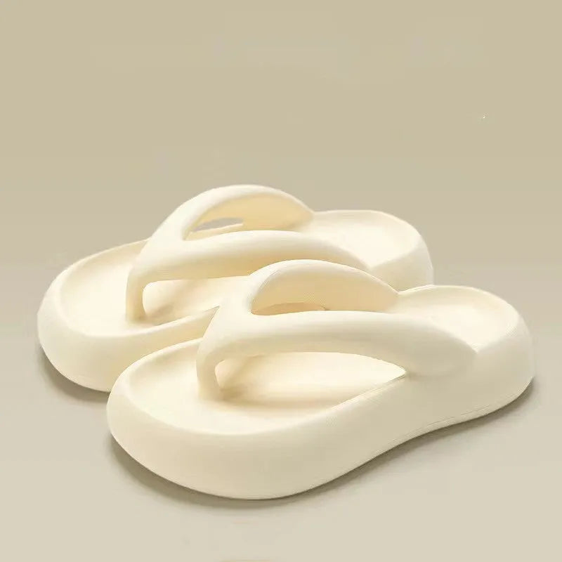 Solid colour thick-soled flip-flops with a bow on the strap, shown in multiple colour options.