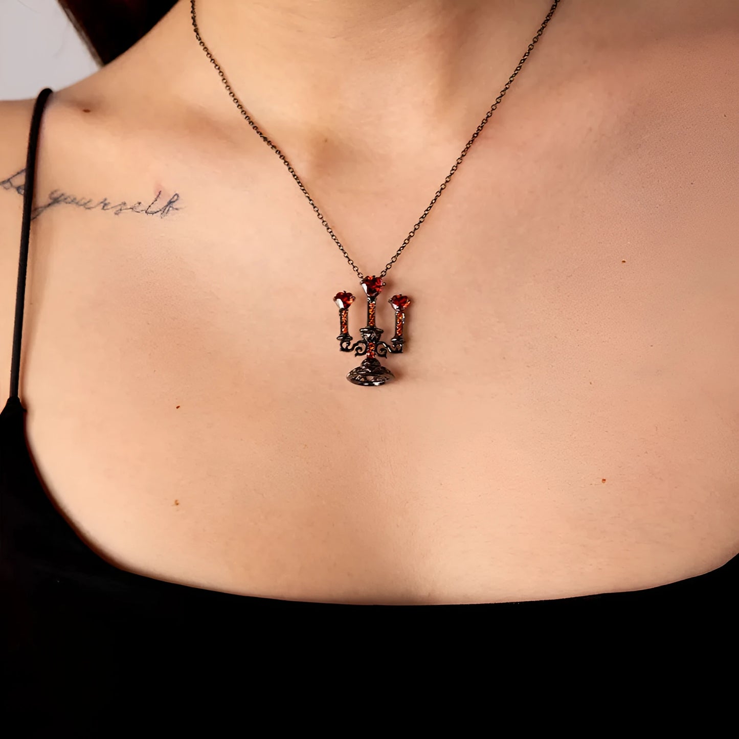 Women's zinc alloy Gothic clavicle chain with a hollow retro candlestick pendant on a cross link chain.