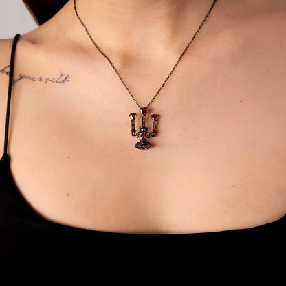 Women's zinc alloy Gothic clavicle chain with a hollow retro candlestick pendant on a cross link chain.