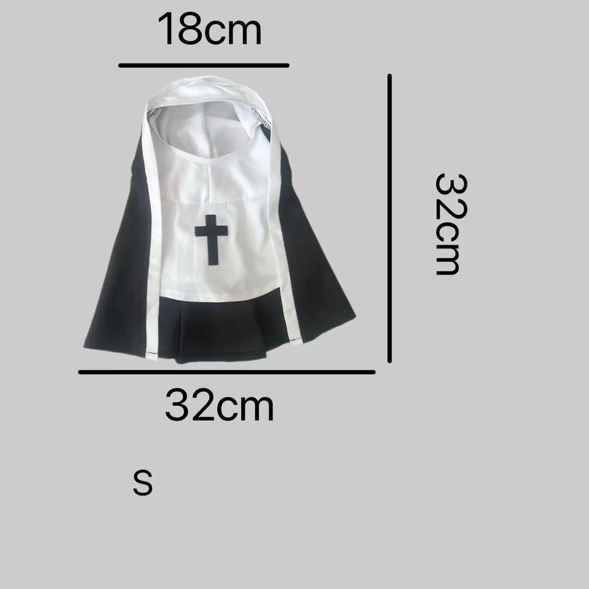Black and white nun costume cloak for a small dog on a Halloween backdrop.