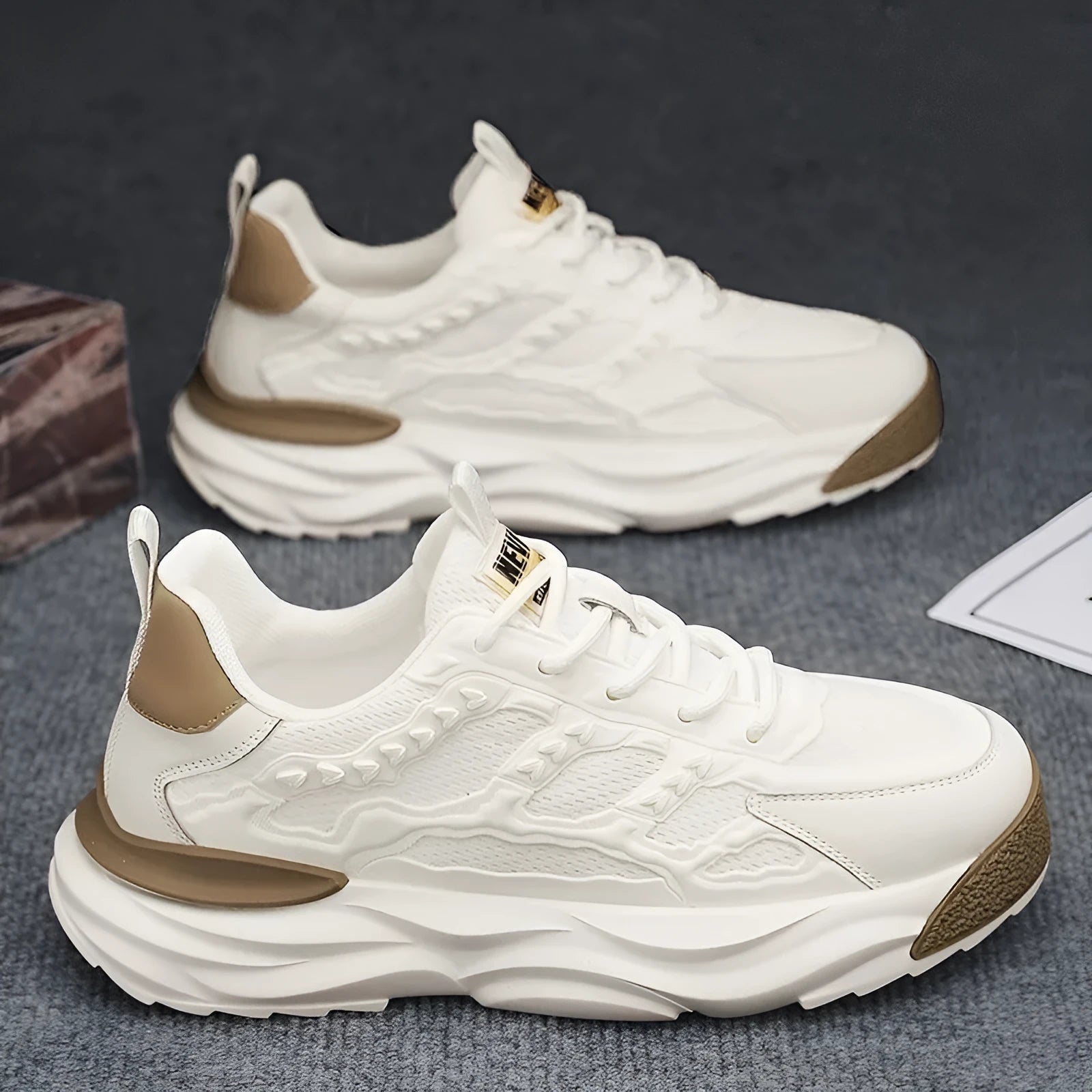 Men's solid colour breathable mesh casual shoes with round toe, shown in white and black.
