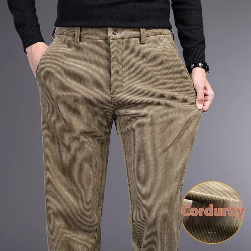 Man wearing khaki and black striped straight-leg retro trousers with a zip fly.