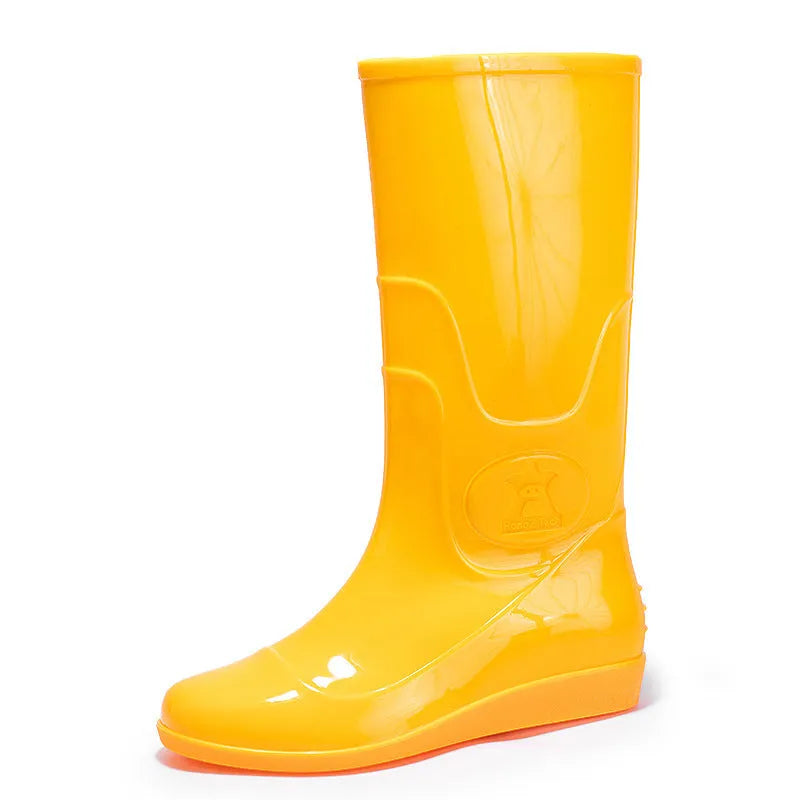 Plastic washable rain boots in white and yellow colours showing high tube Wellington-style design