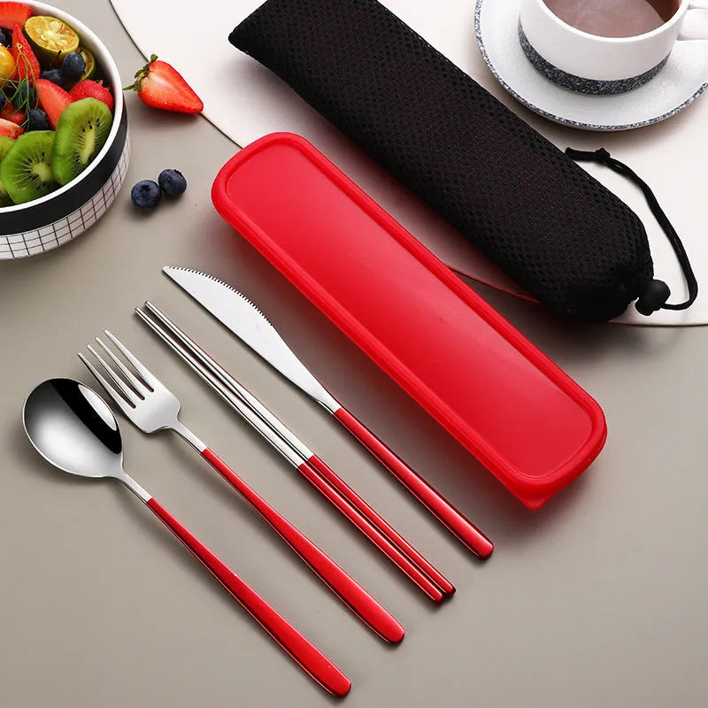 Gold and black stainless steel knife fork spoon set inside a grey mesh carrying bag.